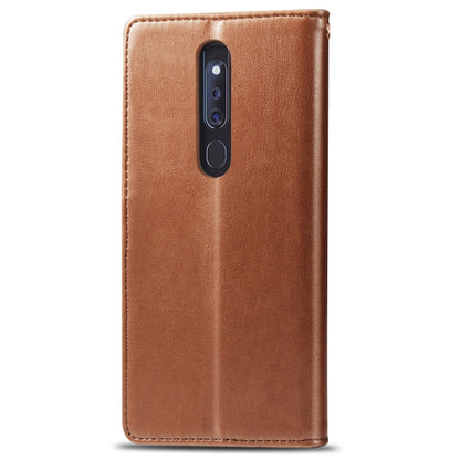 Tan leather flip phone case with camera cutout and protective side coverage