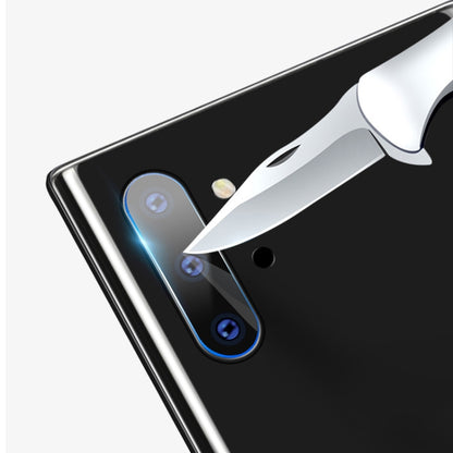 mocolo tempered glass rear camera lens protector being applied to a phone back