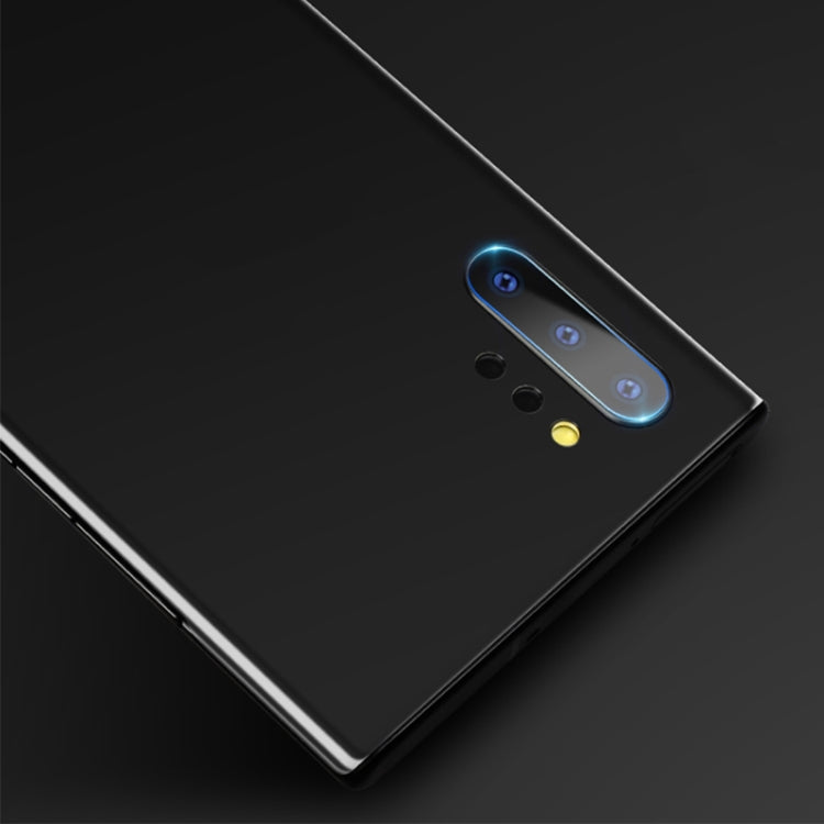 Rounded tempered glass camera lens protector covering the phone rear lens module