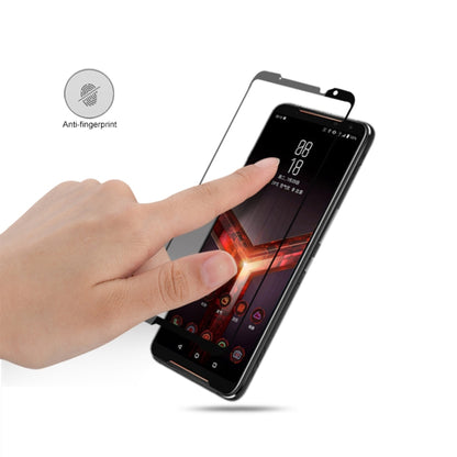 Tempered glass screen protector being applied, anti-fingerprint feature icon