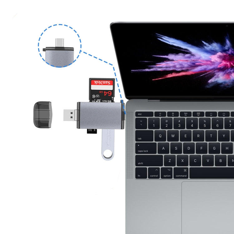 USB OTG card reader connected to a laptop USB port with white keyring