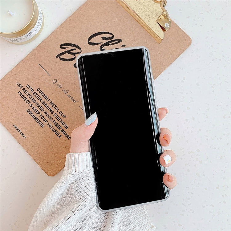 Clear geometric phone case with circular ring holder, shown on a phone