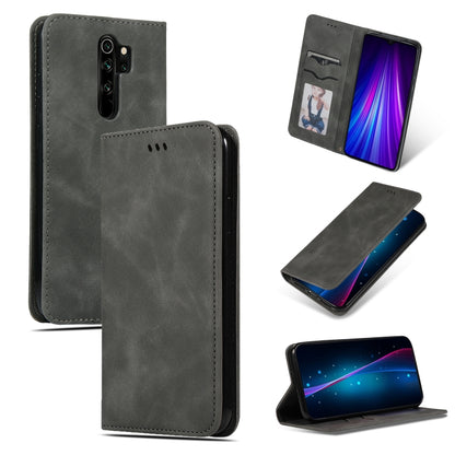 Dark gray magnetic flip leather phone case with card slot and camera cutout; stand view