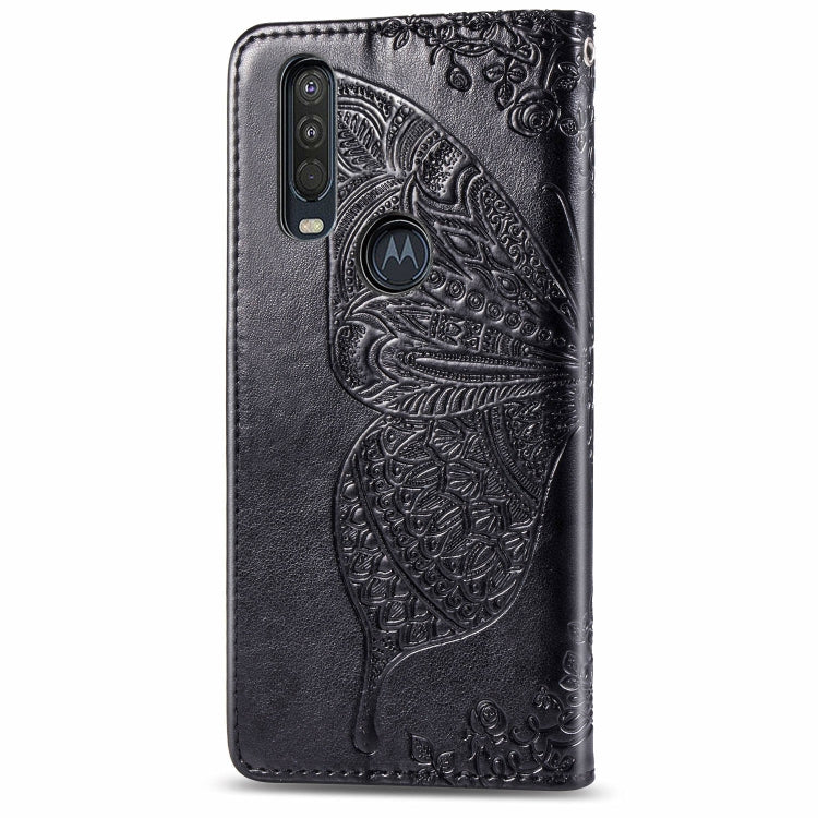 Black embossed leather flip case with butterfly design and cutout for camera