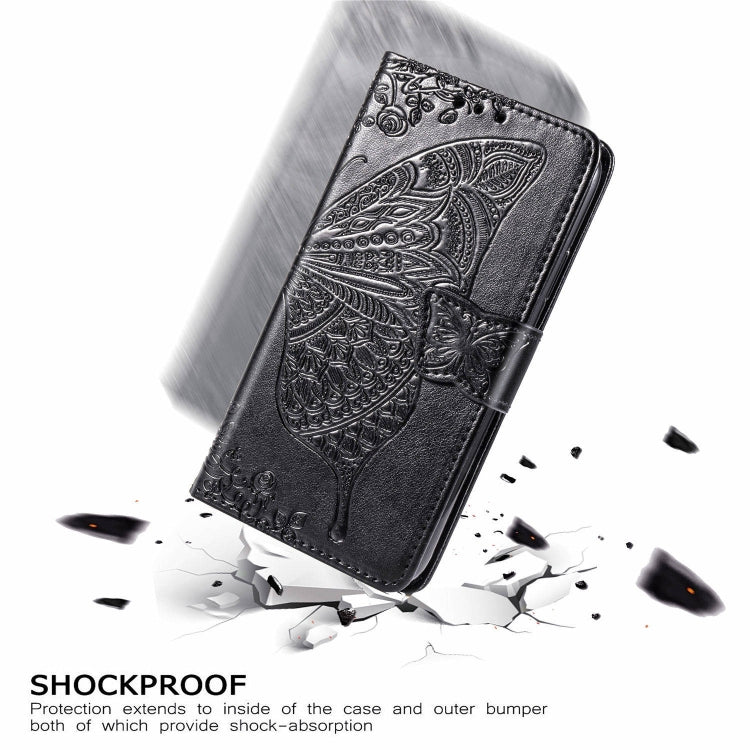 Black embossed leather flip wallet case with butterfly design, shown angled with debris