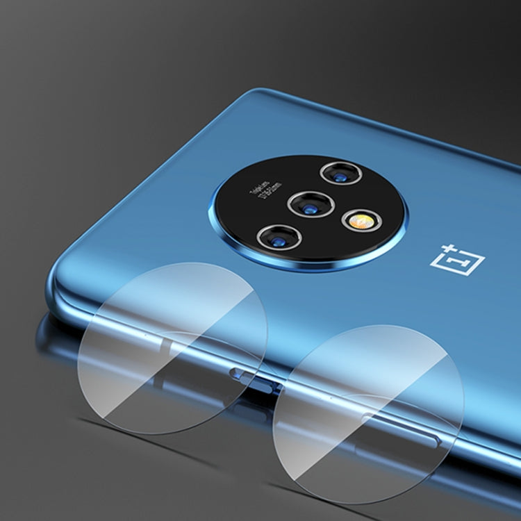 Tempered glass rear camera lens protector covering a triple-camera module