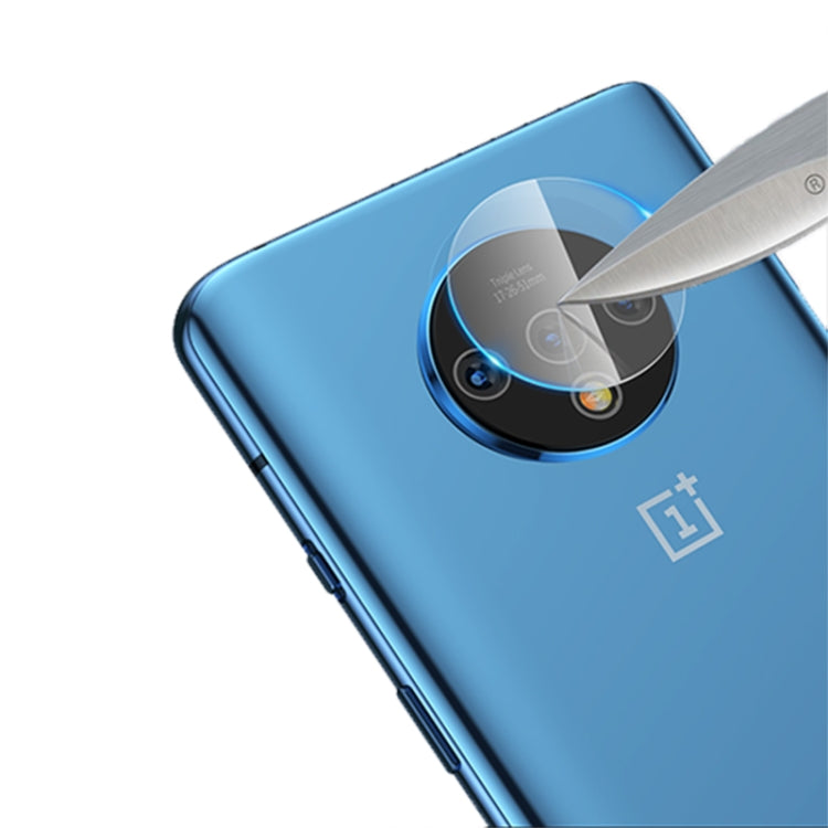 Tempered glass camera lens protector applied to blue phone rear camera, with tool
