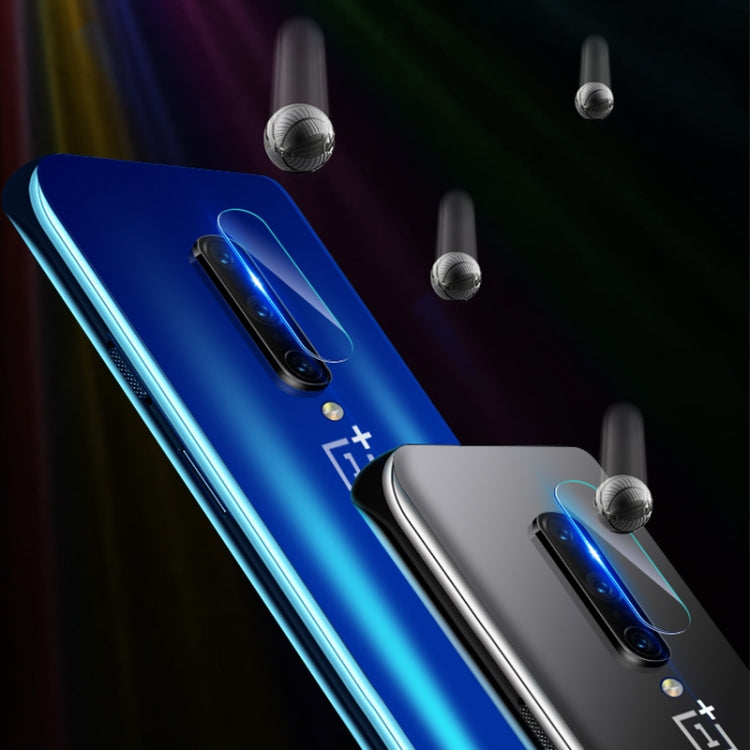 Two phones with tempered glass rear camera lens protectors installed