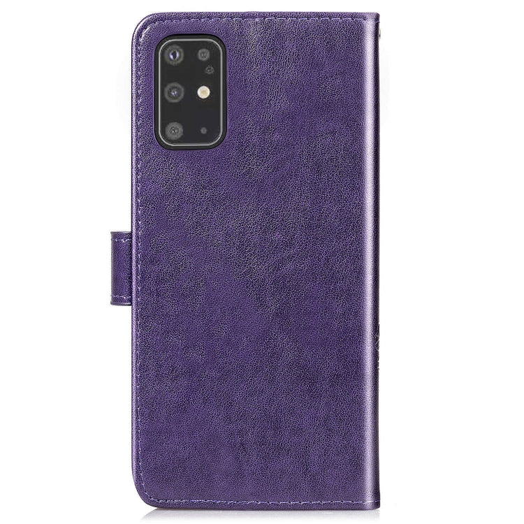 Purple leather phone wallet case with embossed floral detail and camera cutout