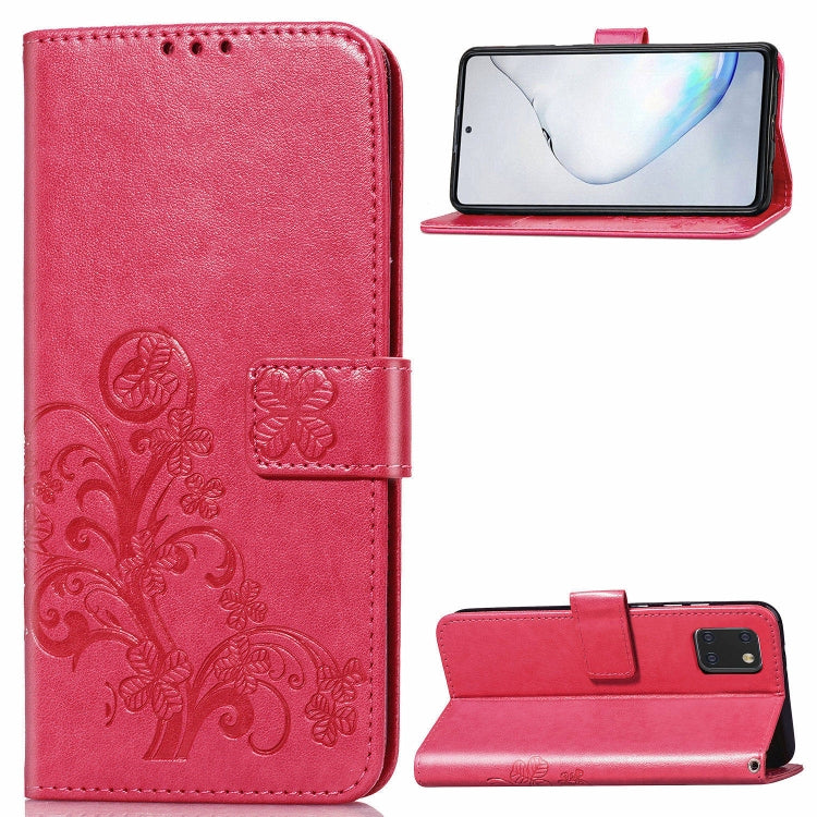 Phone folio wallet case with pressed flower embossing, card slots, and kickstand; rose red.