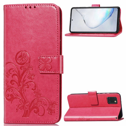 Phone folio wallet case with pressed flower embossing, card slots, and kickstand; rose red.