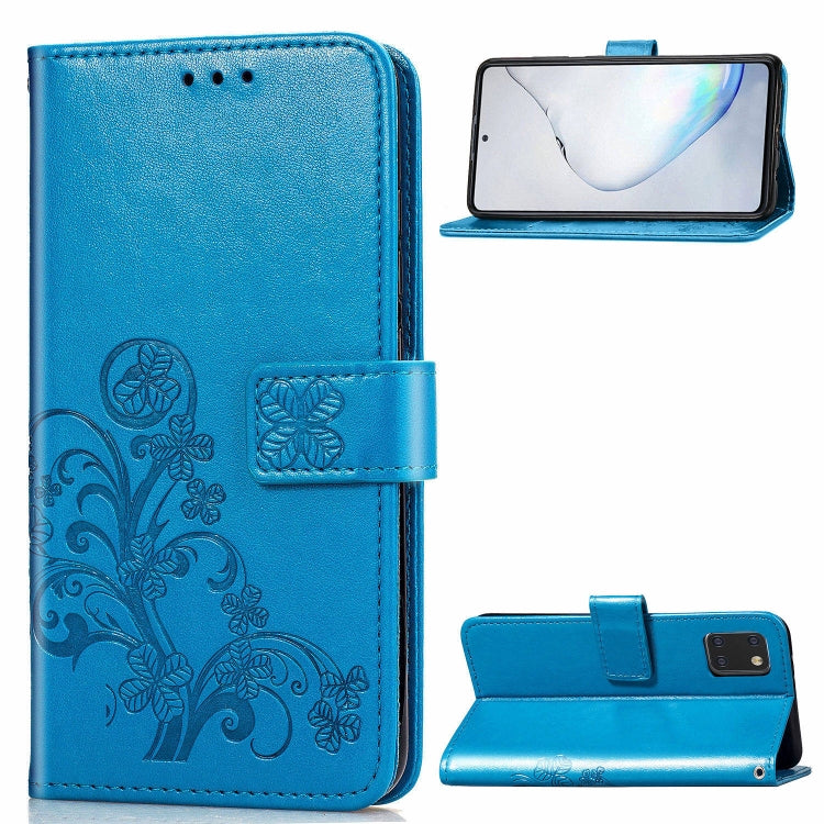 Blue phone wallet folio case with pressed flower design, card slots, and standing cover.