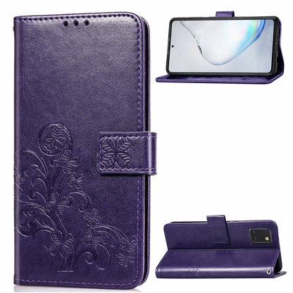 Purple phone folio wallet case with pressed flower embossing, card slots, and kickstand.