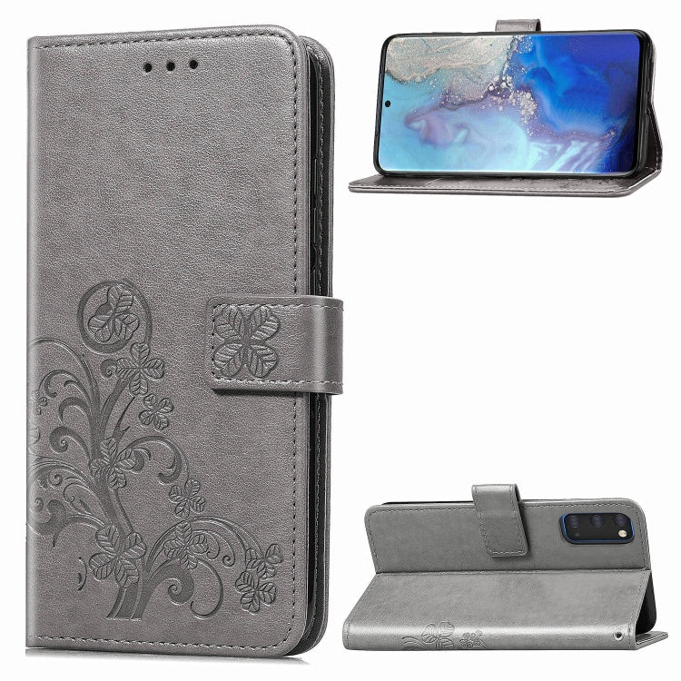 Gray phone folio wallet case with pressed flower embossing, card slots, and kickstand.