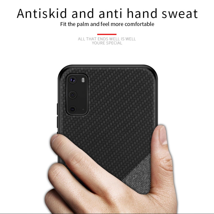 Black shockproof phone case with textured surface; hand gripping for anti-slip hold
