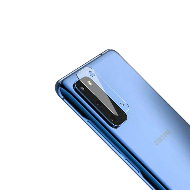 Tempered glass rear camera lens protector film on blue phone back, angled camera module