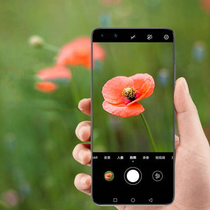 Rear camera lens protector tempered glass film applied to phone, hand holding
