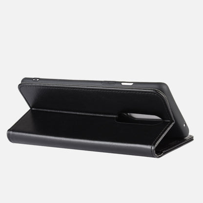 Black flip phone case in stand position with side hand strap