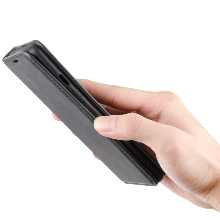 Black leather wallet phone case with side cutouts; hand holds the flip cover