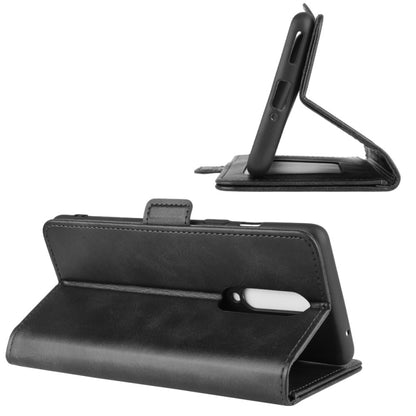 Black leather flip wallet phone case used as a hands-free stand