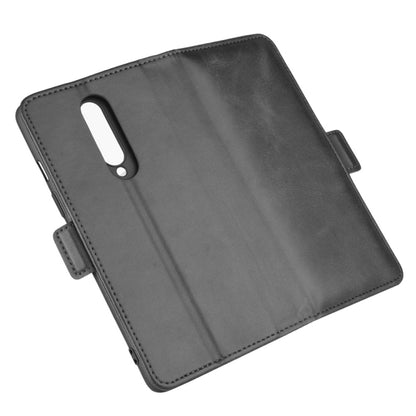 Black leather flip phone case with camera cutout and side strap