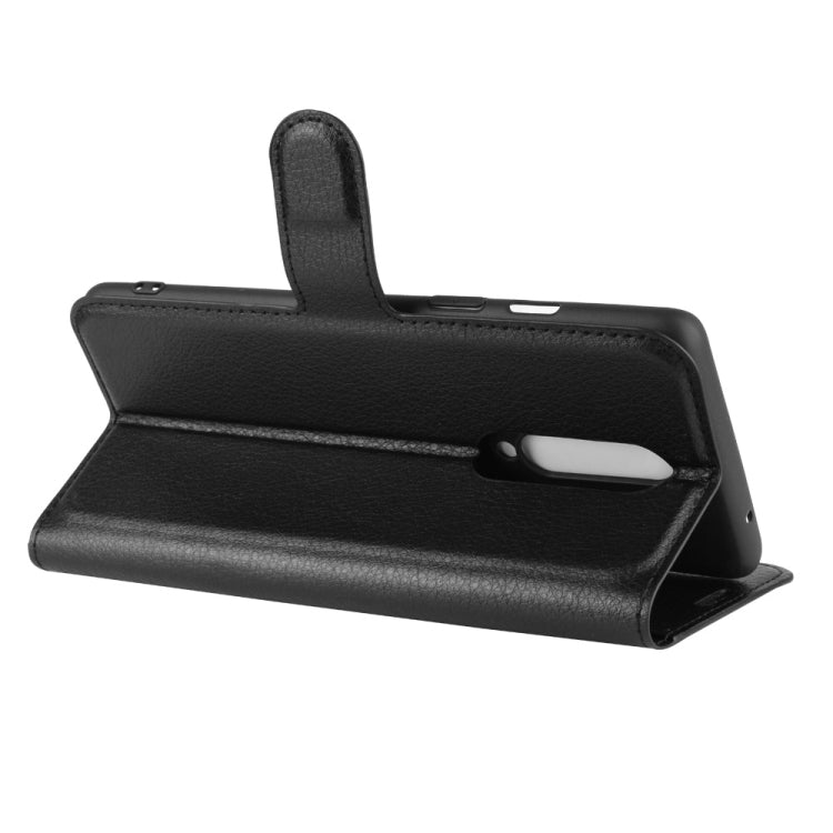 Black flip phone case with stand and front cover opening, textured leather look