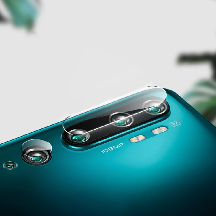 Tempered glass rear camera lens film on teal phone, angled view of covered lenses