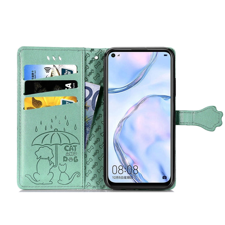 Mint green flip phone case open view with card slots and embossed cat-and-dog detail.