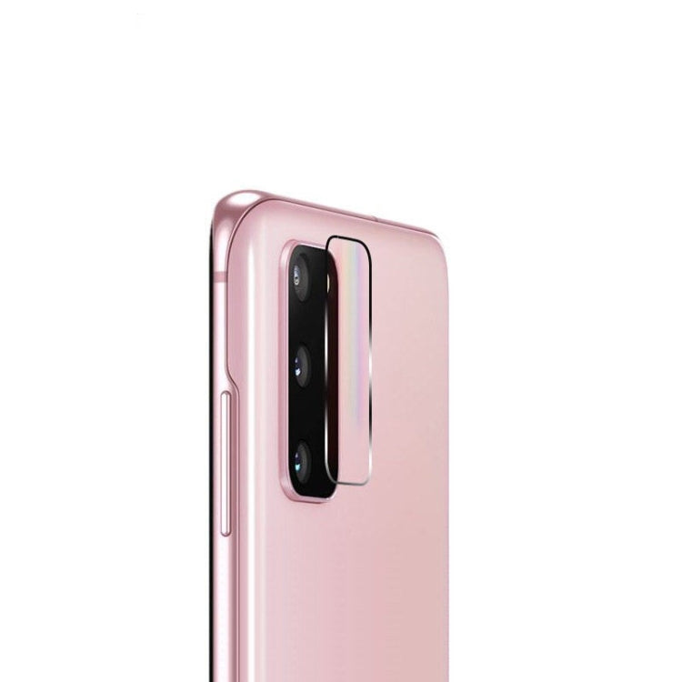 Rear camera lens tempered glass film on pink phone, transparent curved cover over lens