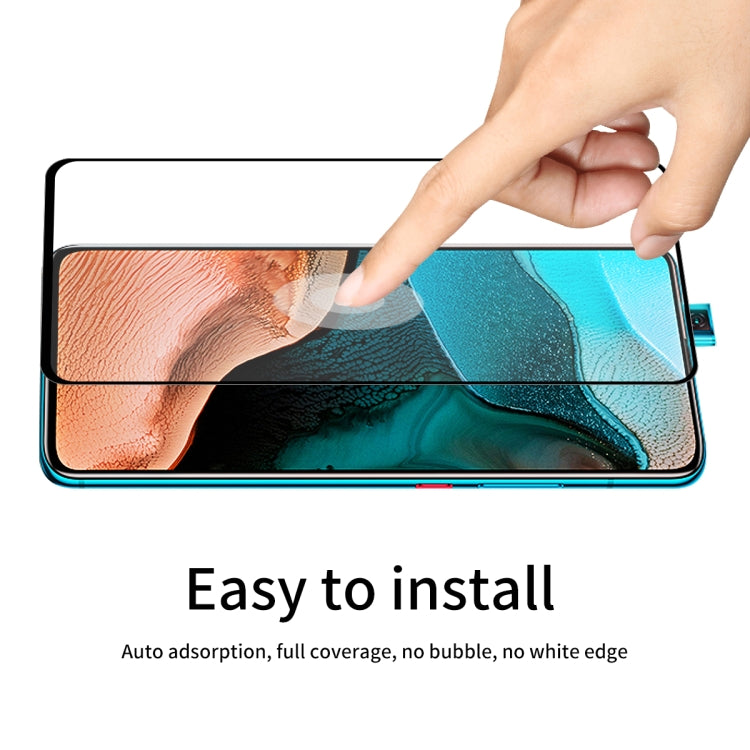 Hand applying a full-coverage tempered glass screen protector, no bubbles