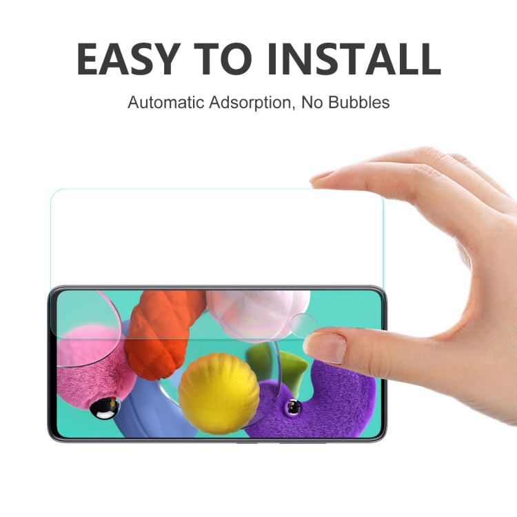 Hand placing a clear tempered glass screen protector over a phone