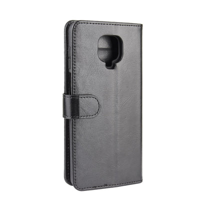 Light gray leather flip phone case with camera cutout and closure strap