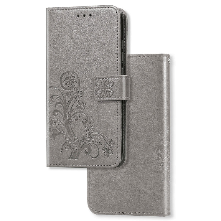 Gray leather phone wallet case with pressed clover floral pattern and flip cover with cutouts