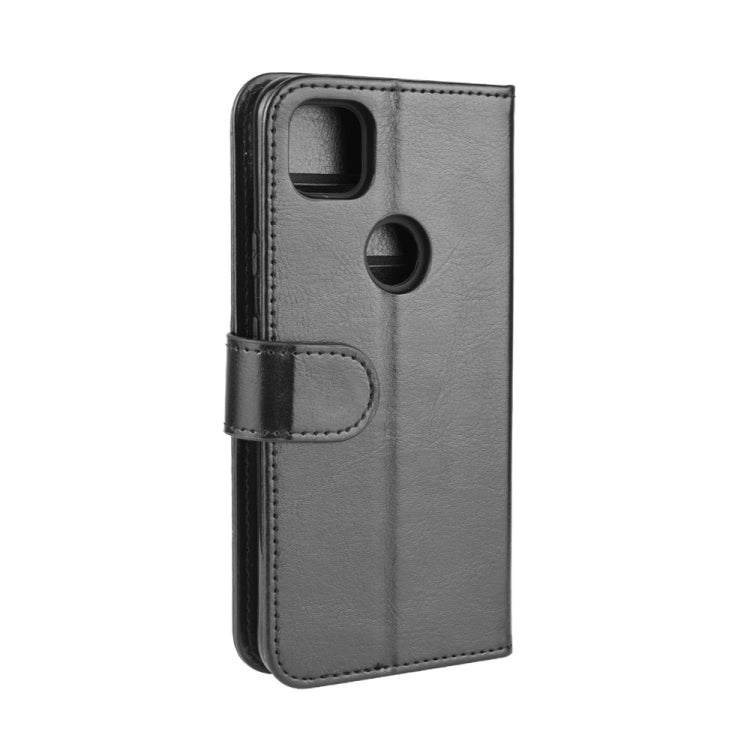 Google Pixel 4a side view of flip wallet case with strap and dark textured leather-style