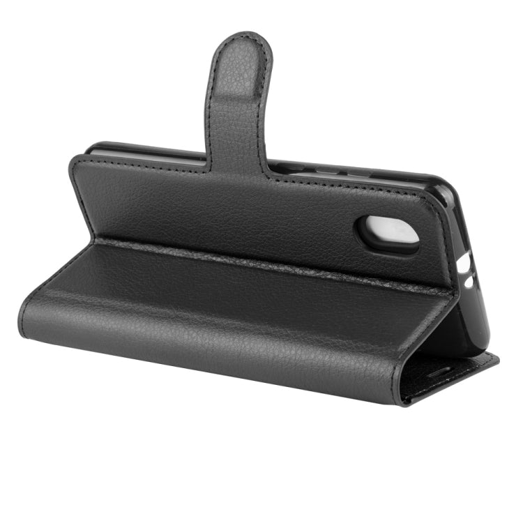 Black litchi-texture horizontal flip phone case with folding stand and cutout