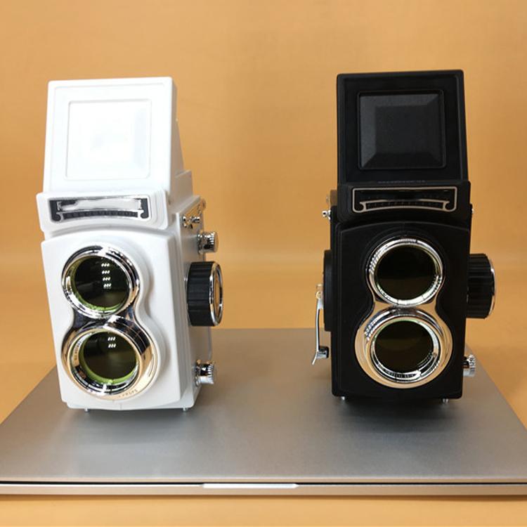 White and black retro double reflex camera props on a table