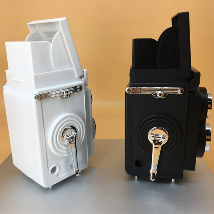 White and black retro double reflex camera props, side view with dials