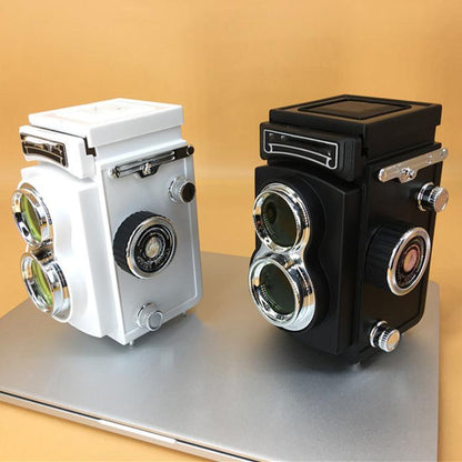 White and black retro double reflex camera props with top cases and twin lenses