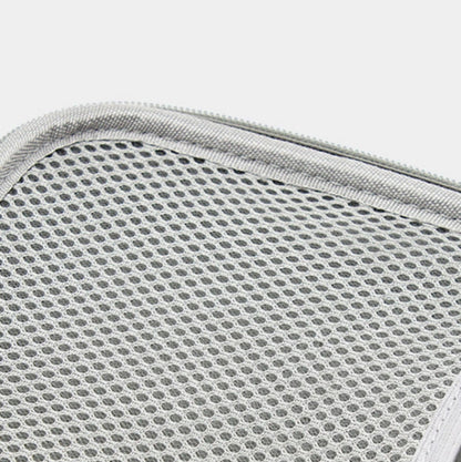 Gray mesh interior panel inside zippered cable storage bag