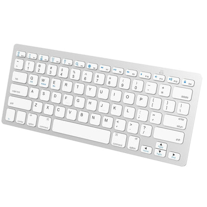 Silver mini wireless Bluetooth keyboard with full QWERTY keys and function buttons