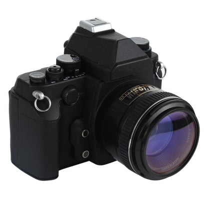 Black DSLR-style fake camera model with attached lens and top flash unit
