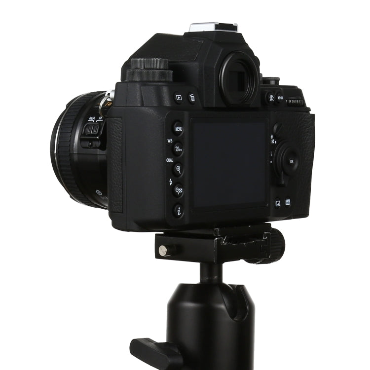 Black DSLR-style fake camera model angled front view on display stand