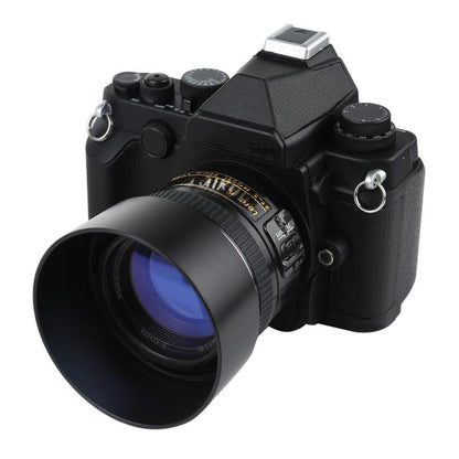 Black DSLR-style fake camera model close-up front with large lens hood