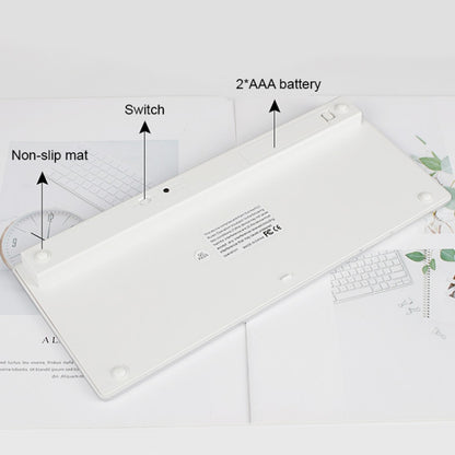 Flat lay of thin mini wireless keyboard with non-slip mat and battery area