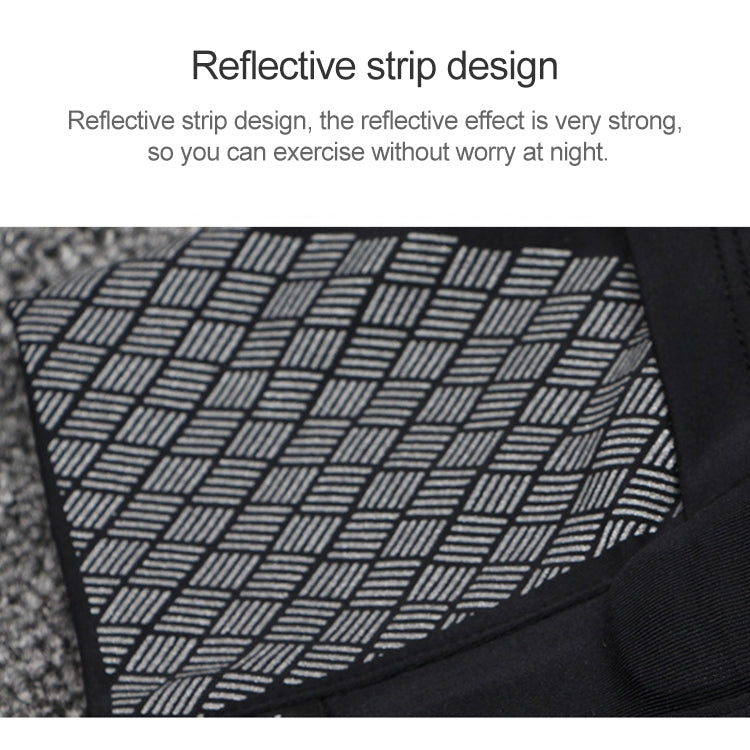 Close-up of reflective strip design on dark arm bag fabric