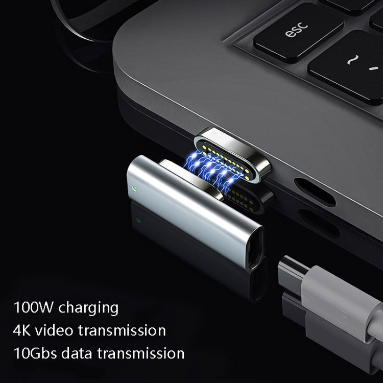 Silver 20-pin magnetic USB-C elbow adapter connected to a USB port, glowing pins
