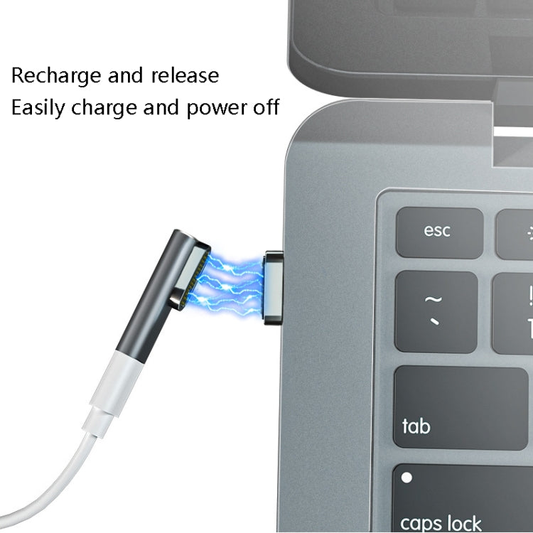 Silver 20-pin magnetic USB-C elbow adapter docking to a laptop USB-C port
