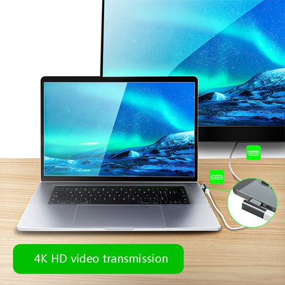 Magnetic USB-C elbow adapter connected to a laptop, showing 20-pin connector