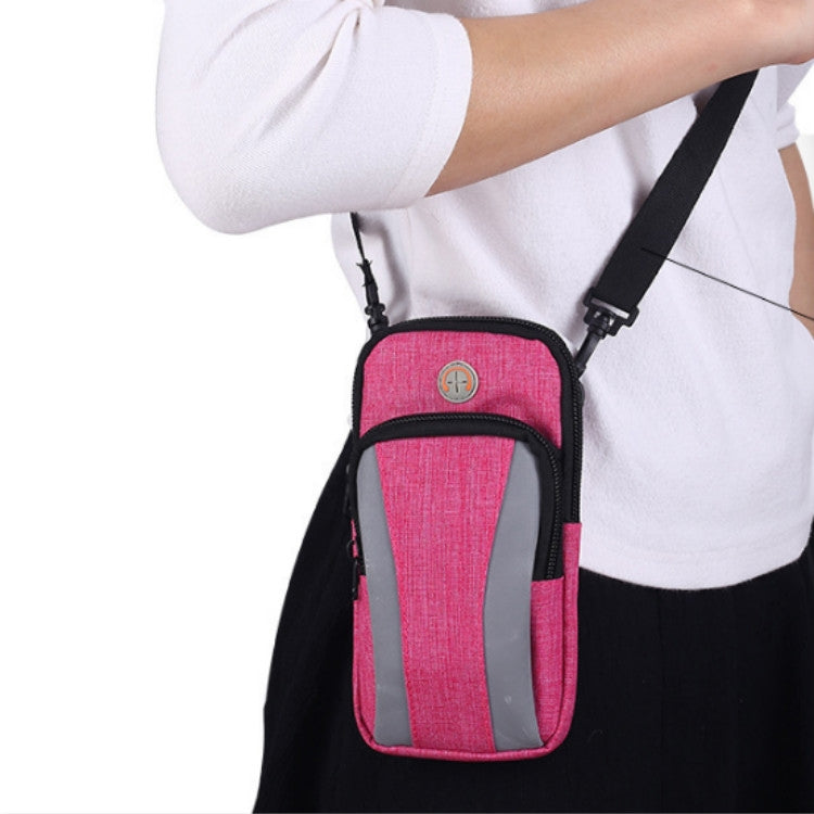 Pink smartphone armband with gray window and black straps, adjustable crossbody style.