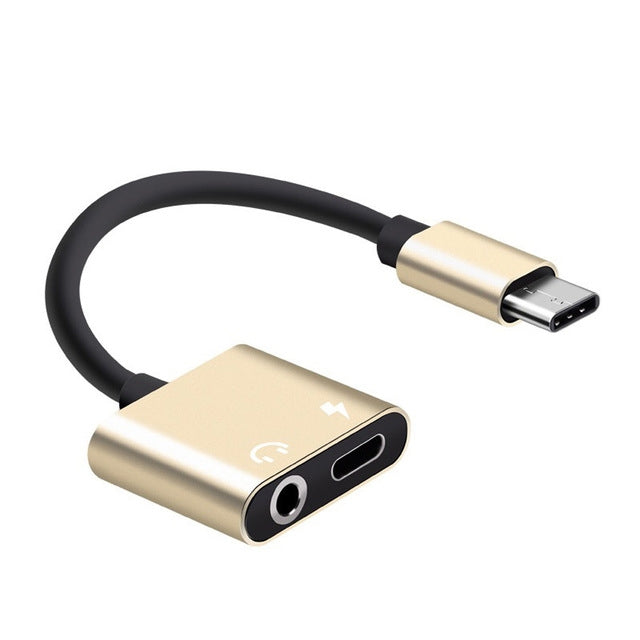 Gold USB-C to 3.5mm aux and USB-C charging adapter audio cable with black cord